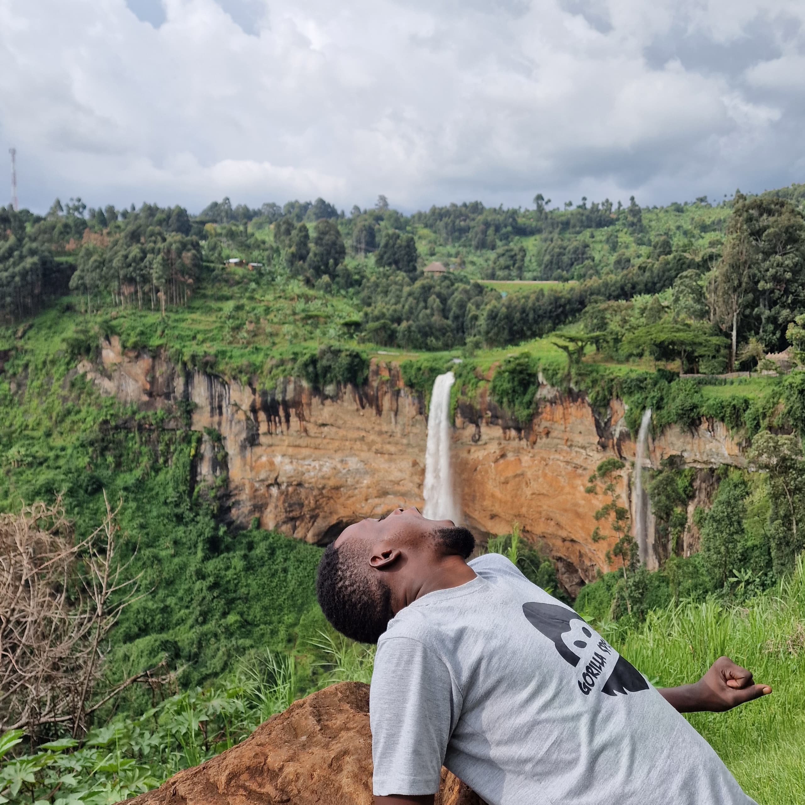 Local guide enjoying the spectacular waterfall vista